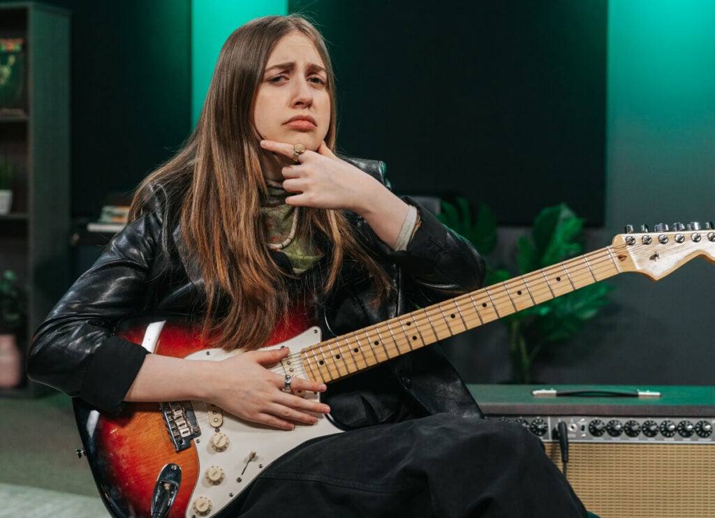 Is it hard to learn guitar? This guitar player looks concerned