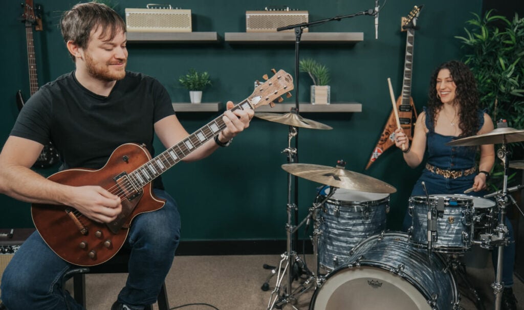 rob scallon and jessica burdeaux - a drummer and guitarist jamming