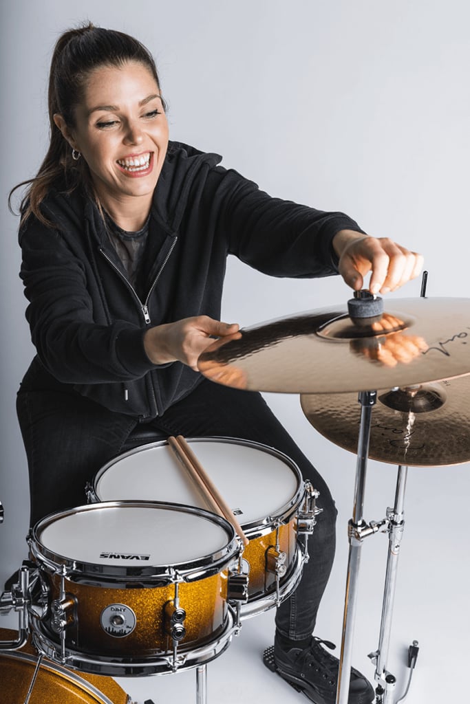 putting a cymbal on a stand