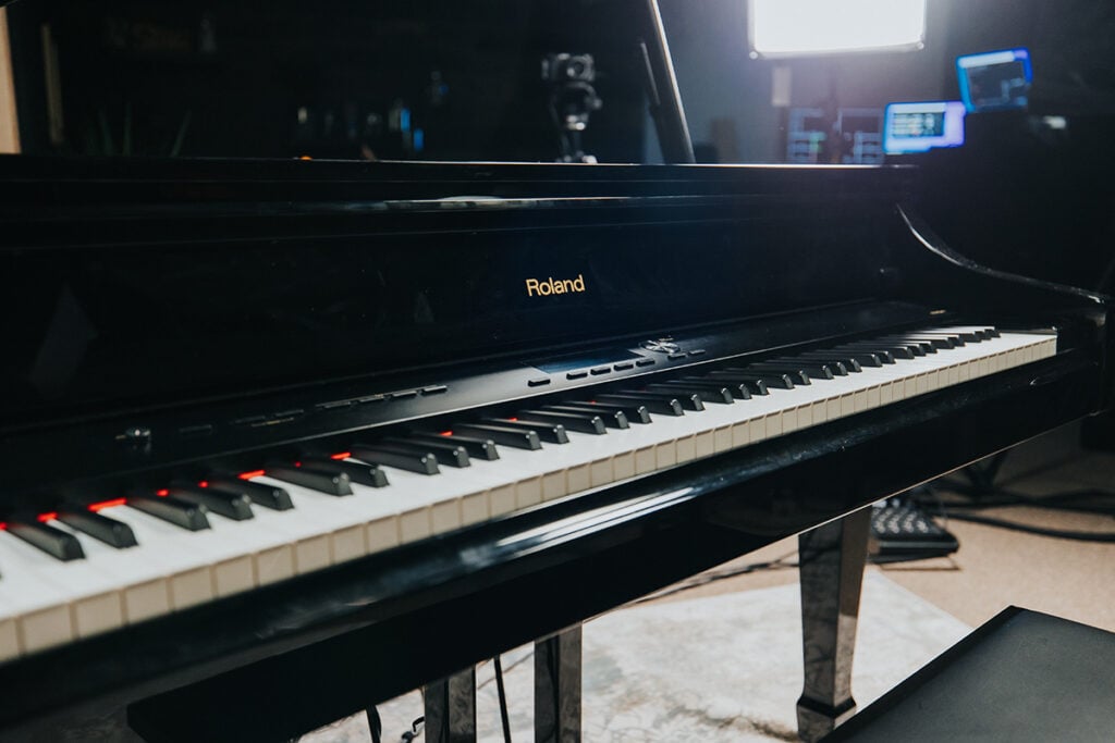 Angled view of Roland V-Piano keyboard in studio.