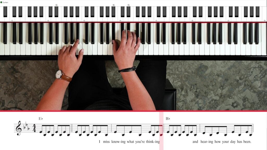 Overhead view of hands playing Wish You the Best with sheet music, chords, and highlighted keyboard.