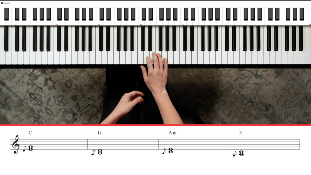 Screencap of hands playing sus trills to third and fifth of triad with standard notation underneath.