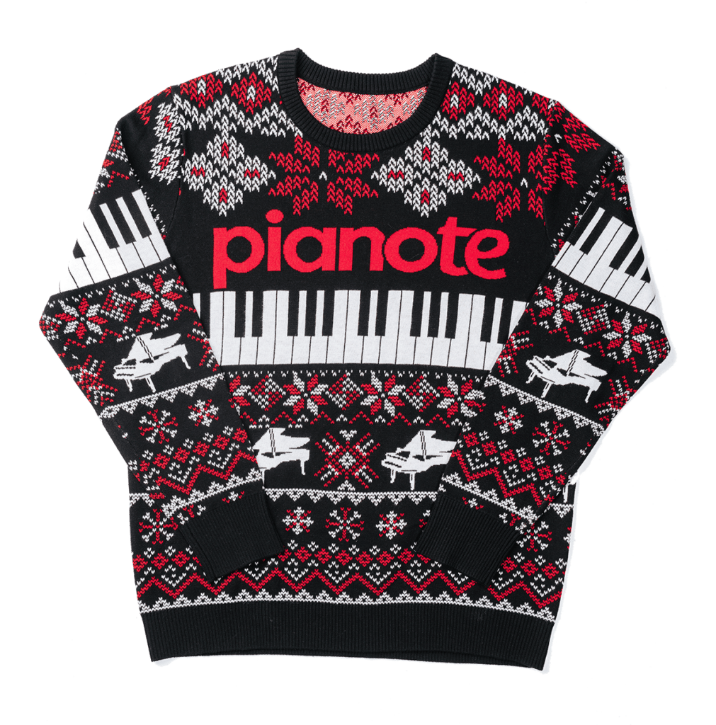 Sweater with piano keyboard and Christmas all-over print.