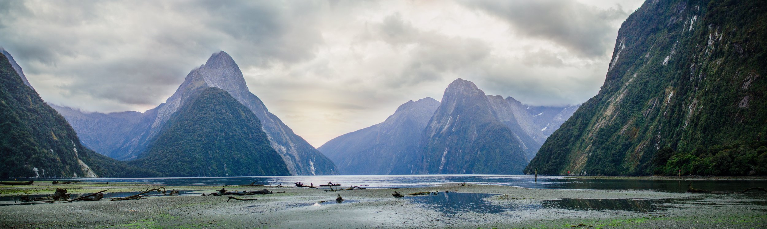 Serene landscape of mountains and water.